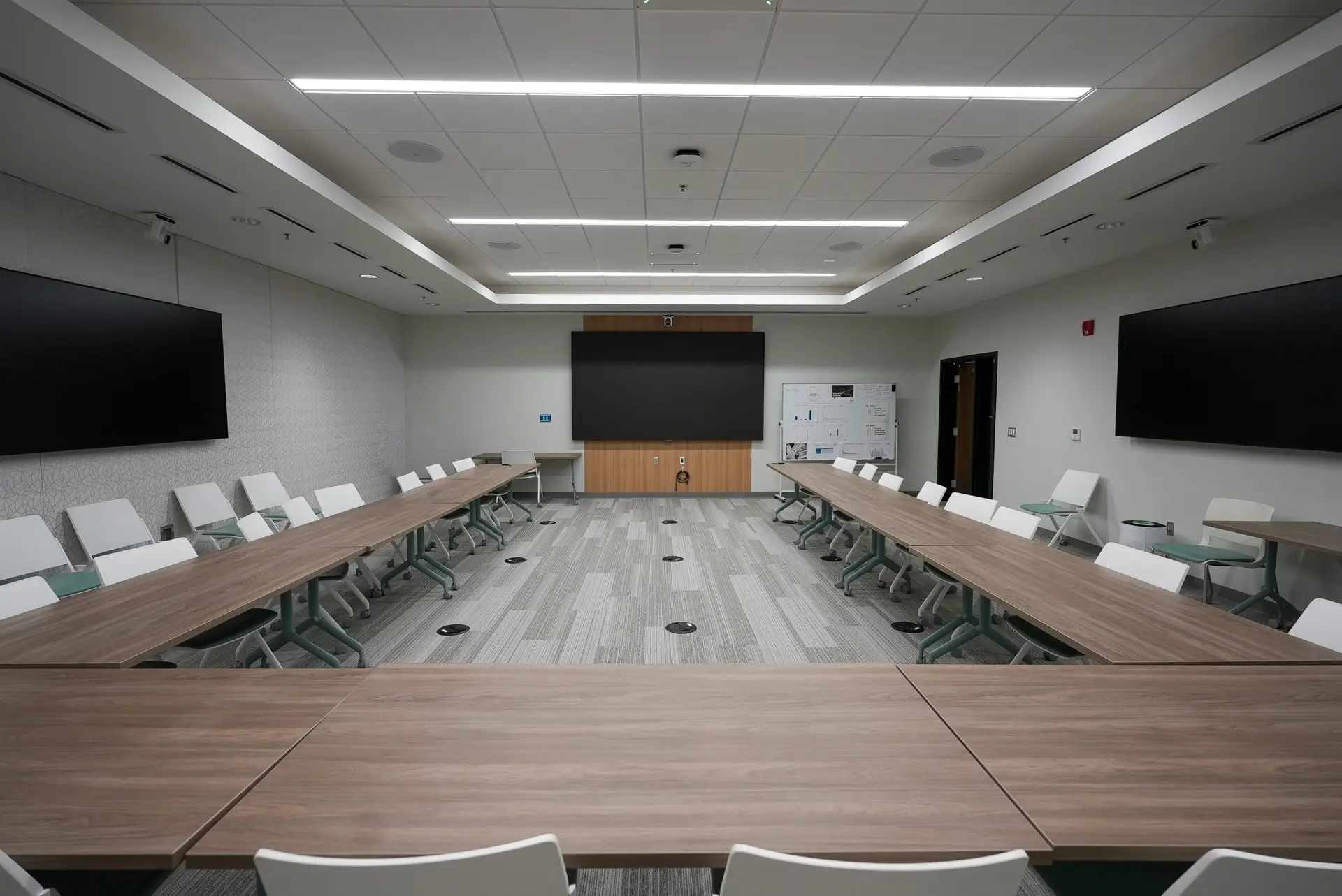 Nexstar boardroom featuring display deployment and hybrid conferencing audio-visual integration by Ramcom.